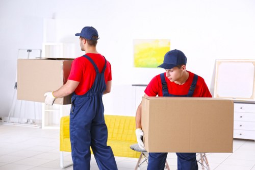 Removal team reviewing a customer complaint form after a moving service issue