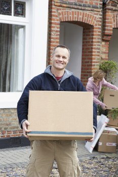 Furniture removal team loading a sofa in Catford