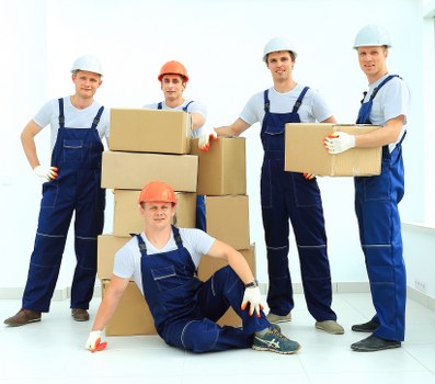 Moving team preparing boxes and furniture for a Catford relocation