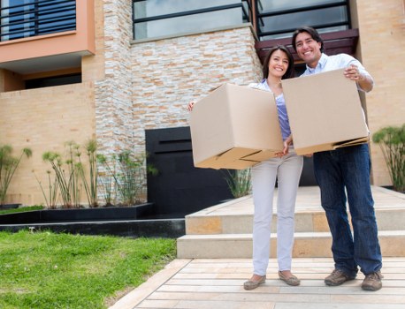 Commercial movers loading office items for transport in South East London